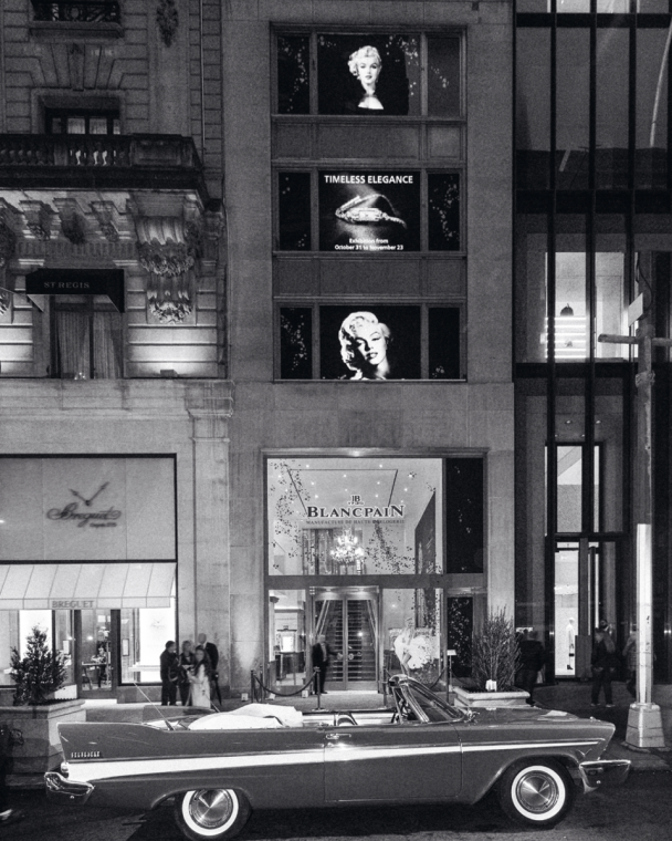 Opening night of the New York exhibit, a vintage American convertible for a 1960s vibe.
