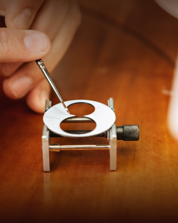 Enamel is painted upon the dial’s surface by hand.
