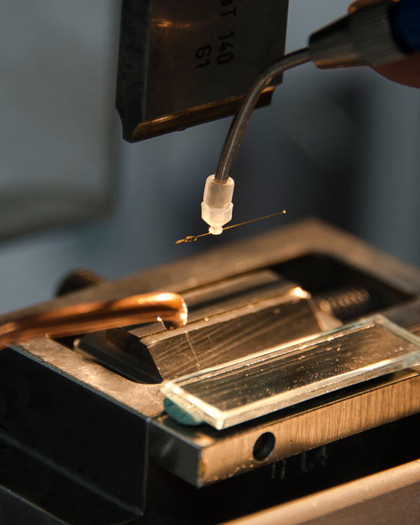 The shaping of hands with a stamping tool.
