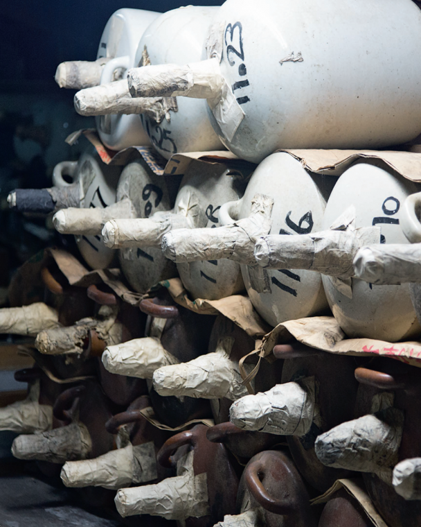 Porcelain jugs, marked by year, in storage at Tsukino Katsura.
