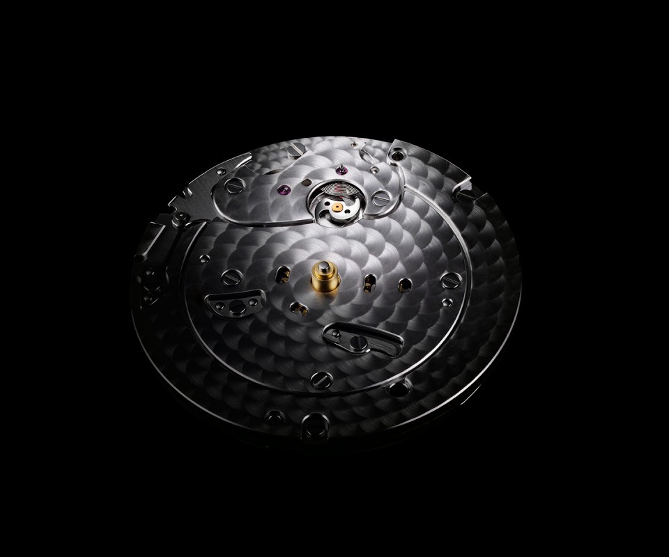 The dial side view of&nbsp;the movement showing&nbsp;the snail cam and spiral&nbsp;that are central to the retrograde seconds mechanism.
