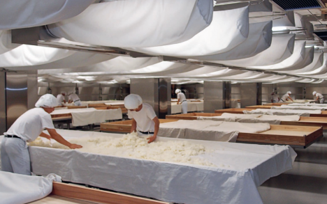 Mixing the rice/mold combination to ensure even distribution of the mold.
