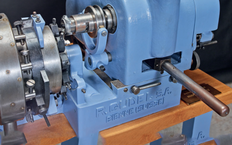 A historic Güdel case carving machine.
