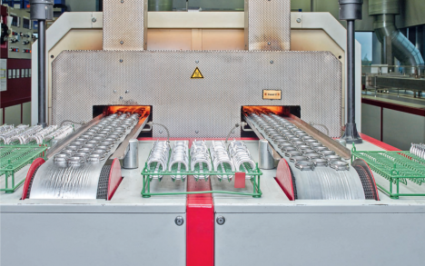 In between successive stamping operations, the cases undergo a heating process.
